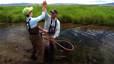 Guest & Guide Enjoying Fly Fishing on Private Montana Waters