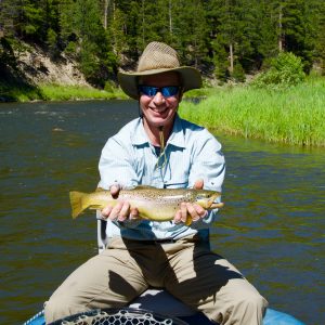 Happy guest with a nice Brown Trout caught on the Smith River