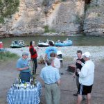 Guests enjoying appetizers at camp on the Smith River