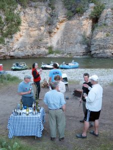 Guests enjoying appetizers at camp on the Smith River