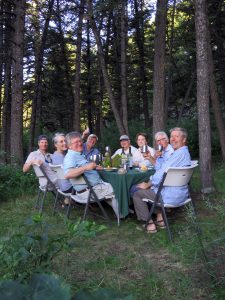 Guests enjoying dinner at camp on the Smith River