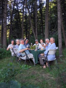 Guests enjoying dinner at camp on the Smith River