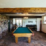 Recreation space with pool table at Healing Waters Lodge