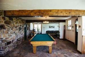 Recreation space with pool table at Healing Waters Lodge