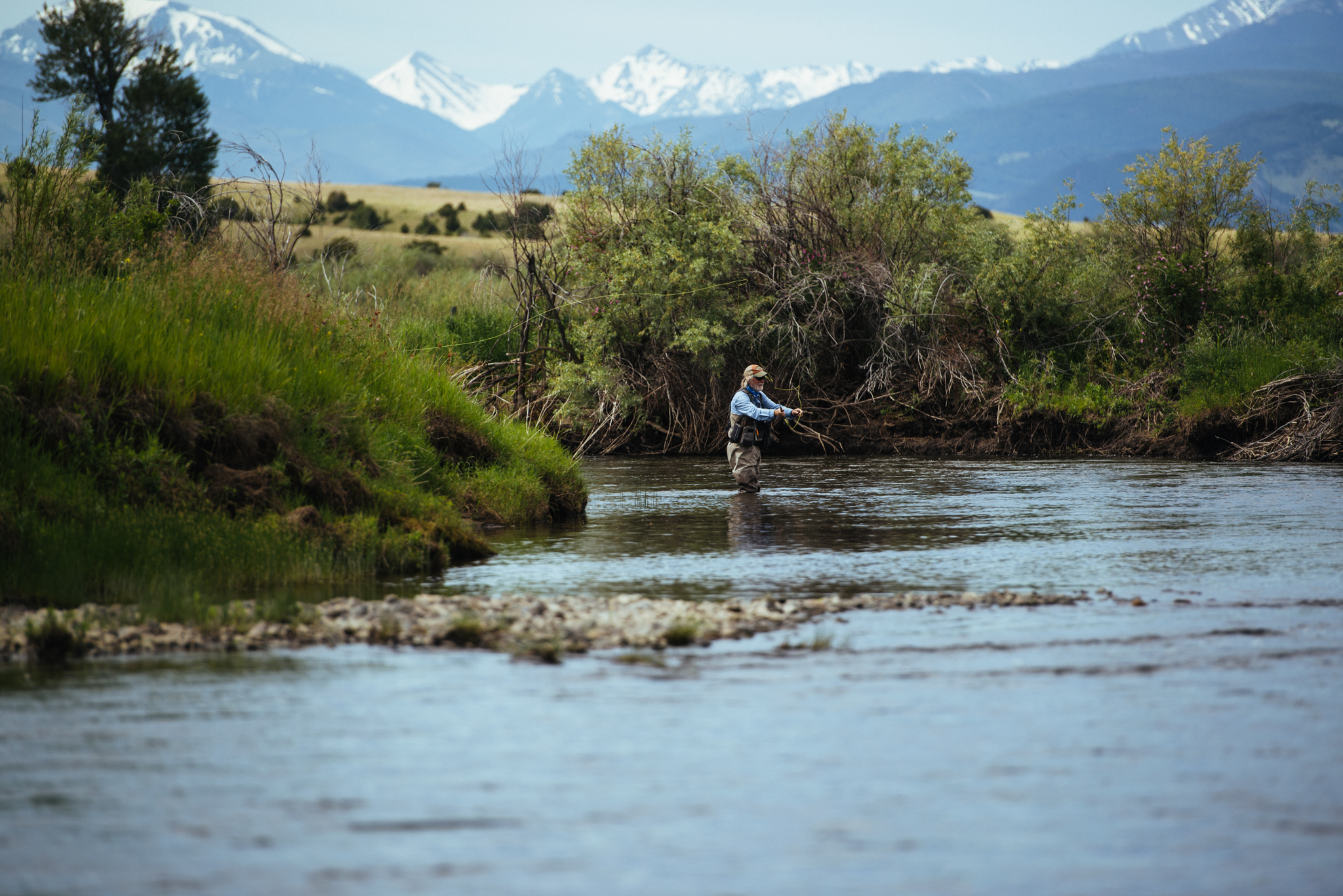 An angler amongst beautiful scenery in Montana
