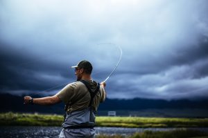 Fly fishing angler on a cloudy day in Montana