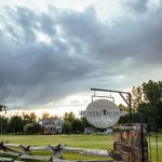 Signage & lush landscape at Healing Waters Lodge